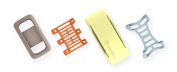 Tractive tracker accessories, including the tracker and various mounting clips.