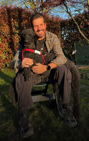 Edoardo Stoppa with dog and Tractive GPS